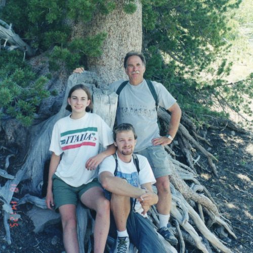 Neil, Mike, and Lindsey pose together for a photo on a family hike.